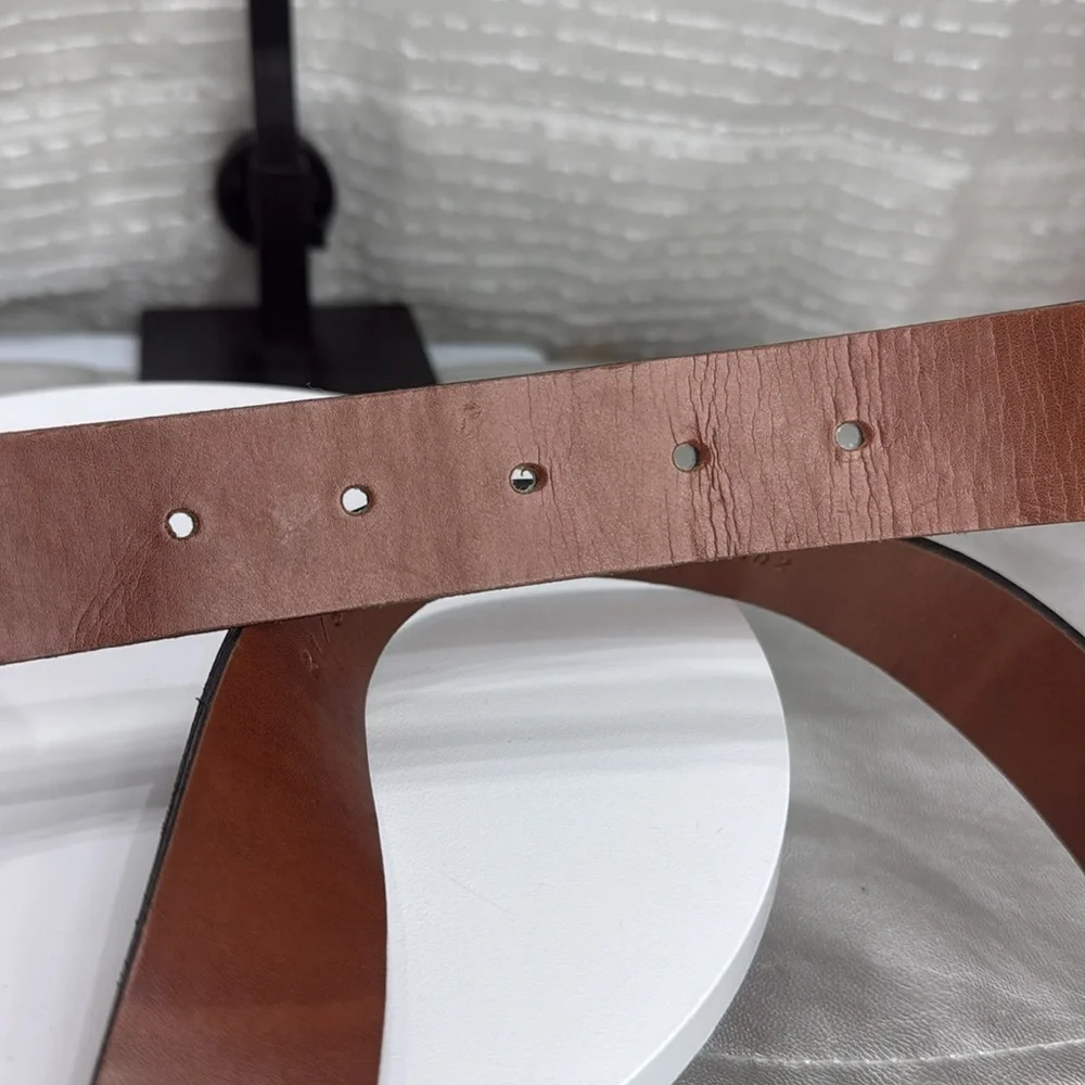 (H)Two Pebble Beach boys' leather belts with black and white metal silve buckles